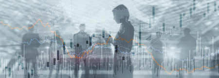 Silhouettes of people on the background of financial graphs and chartsの写真素材