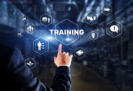 Trainning concept. Businessman pressing on touch screen interface inscriptionの写真素材