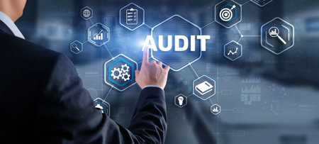 Audit. Checking the financial statements of the company. Businessman touching Audit on 3d virtual screenの写真素材