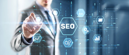 Businessmans fingers pressing a button SEO. Search engine optimizationの写真素材
