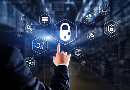 Businessman presses cybersecurity button on virtual screensの写真素材