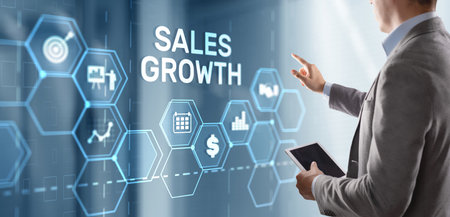 Sales Growth Man clicks inscription on virtual 3D screenの写真素材