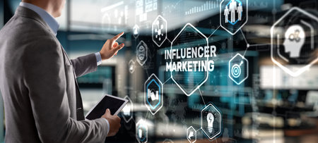Man clicks on the inscription INFLUENCER MARKETINGの写真素材