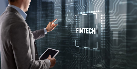 Tapping on the inscription Fintech financial technology digital money internet banking conceptの写真素材
