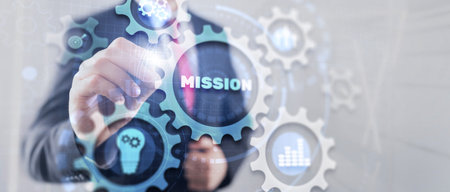 Bisinessman hand touching button mission. Finance backgroundの写真素材