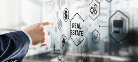 Real estate investment. Businessman pressing on virtual screensの写真素材