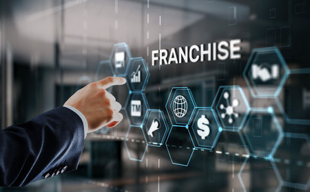 Businessman hand touching inscription Franchise marketing systemの写真素材
