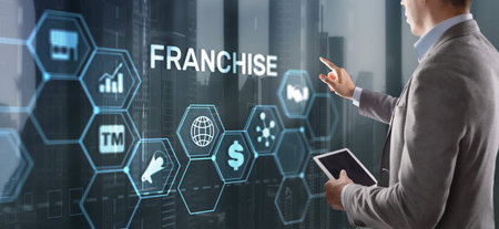 Businessman hand touching inscription Franchise marketing systemの写真素材