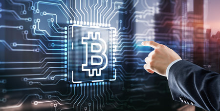 Businessman clicking on virtual screen Bitcoin Cryptocurrency concept. Mining factory. Server racks backgroundの写真素材