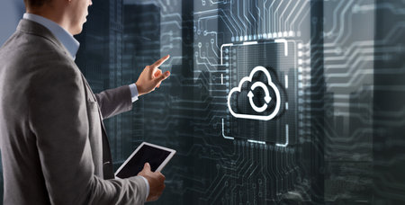 Cloud computing concept. Businessman clicking on virtual screen. Connect to cloud. Cloud computing iconの写真素材