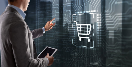 Businessman touching e-commerce button on a virtual interface. Cart online shoppingの写真素材