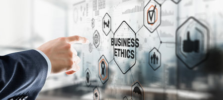 Business man writing business ethic concept on virtual screenの写真素材