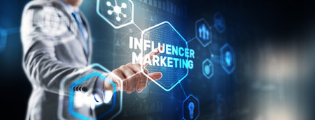 Man clicks on the inscription INFLUENCER MARKETINGの写真素材