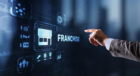Businessman hand touching inscription Franchise marketing systemの写真素材