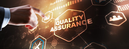 QA Businessman pressing Quality assurance button on virtual screensの写真素材
