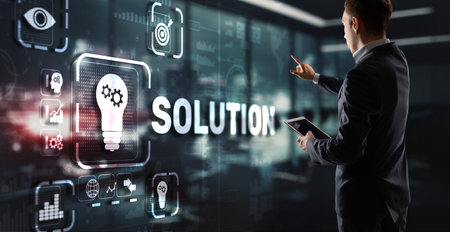 Solution. Businessman pressing on touch screen interface inscription Solutions. Business concept. Internet conceptの写真素材
