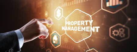 Businessman pressing PROPERTY MANAGEMENT button on virtual screensの写真素材