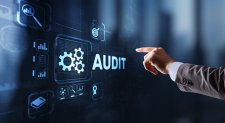 Audit. Checking the financial statements of the company. Businessman touching Audit on 3d virtual screenの写真素材
