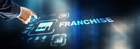 Businessman hand touching inscription Franchise marketing systemの写真素材
