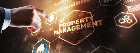 Businessman pressing PROPERTY MANAGEMENT button on virtual screensの写真素材