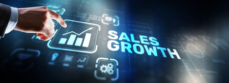 Sales Growth Man clicks inscription on virtual 3D screenの写真素材