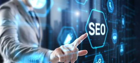 Businessmans fingers pressing a button SEO. Search engine optimizationの写真素材