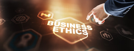 Business man writing business ethic concept on virtual screenの写真素材