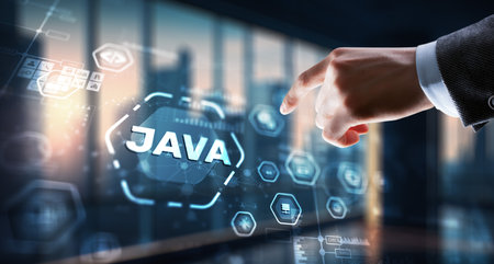 Businessman clicks Java programming language application concept on virtual screenの写真素材