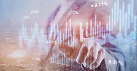 Stock chart wit blue bars, reflecting market trends on grid background.の写真素材