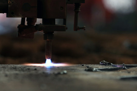 <p>Cnc plasma cutting machine is cutting to steel plate in the factory. A Cnc plasma machine also requires a drive system, consisting of drive amplifiers, motors, encoders, and cables.</p>の写真素材