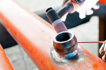 View of the small-branch connection of the pipe with gas tungsten arc welding method. Weldolet is...