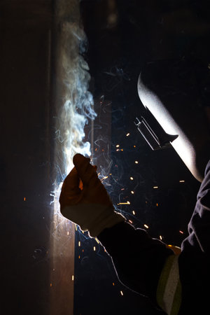 Welder is welding with shielded metal arc welding, manual metal arc welding or stick welding....
