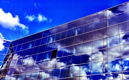 Sky reflection on glass building. の素材