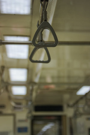 YOGYAKARTA, INDONESIA- November 25, 2021: Selective focus on Hand Strap on the Prameks train...