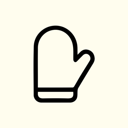 Simple black and white illustration of a mitten offering protection during the cold weather season against frostbite and winter's chillのイラスト素材