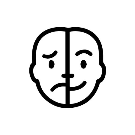 A simple black and white icon showcasing a face with two different expressions joy on one side and sorrow on the other illustrating emotional duality.のイラスト素材