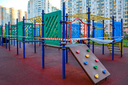 Children's playground is closed. Ban tape. Prevention of coronavirus COVID-19. The fight against the...