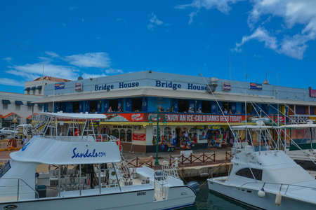 Bridgetown, Barbados, Caribbean - 22 Sept 2018: Motor Boats moored in the downtown marina bay. White clouds in the blue sky. Copy spaceのeditorial素材