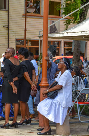 Sainte Anne, Martinique - Sept 19, 2018: Local people waiting for prayer in the church on a beautiful colorful street in Sainte Anne, Martiniqueのeditorial素材