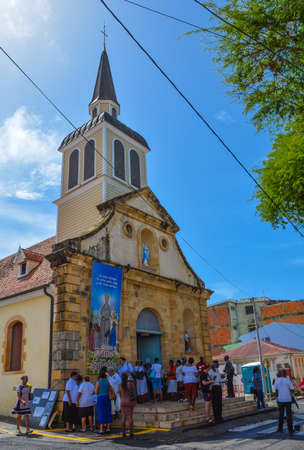 Sainte Anne, Martinique - Sept 19, 2018: Crowd of parishioners on the doorstep of Catholic Church Notre Dame in Sainte Anne, Martiniqueのeditorial素材