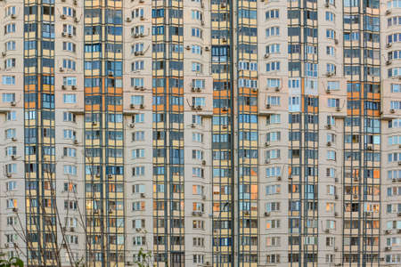 Krasnogorsk, Moscow region, Russia - May 17, 2020: Close-up of the residential facade of a high-rise building with many balconies and windows. Abstractのeditorial素材