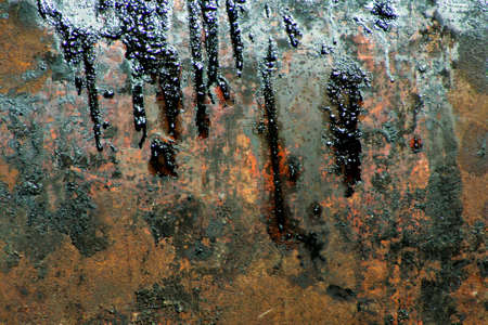 Rusted metal with oil stains.の写真素材