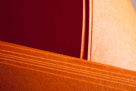 Orange paper textured grunge paper foldsの写真素材