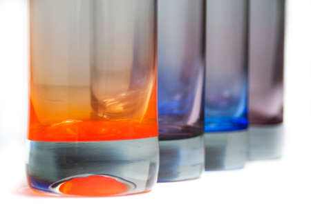 Four brightly colored beverage glasses close-upの写真素材