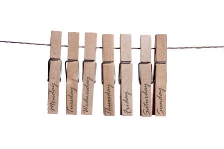 Clothespin whit the days of the week on white backgroundの写真素材