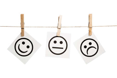 Expression messages held by clothespins on white backgroundの写真素材