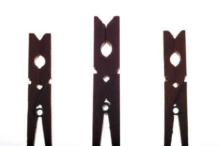 Three back lit clothespinsの写真素材