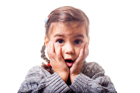 Girl with astonished expression on white backgroundの写真素材