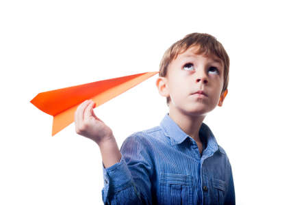 Boy with orange paper planeの写真素材