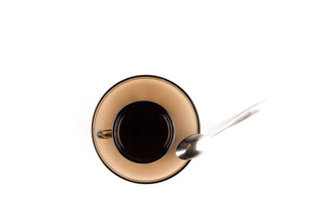 Coffee cup with spoon on white の写真素材